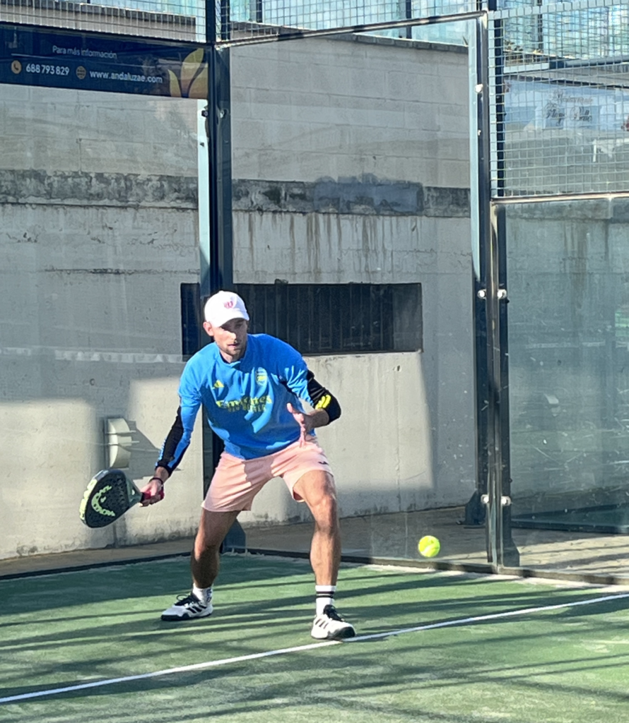 Daniel playing padel on a Spanish pitch.